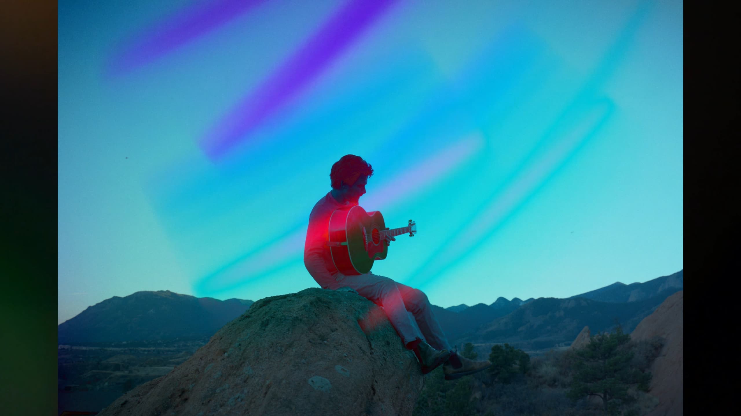 Josh Martin, silhouette against aurora sky